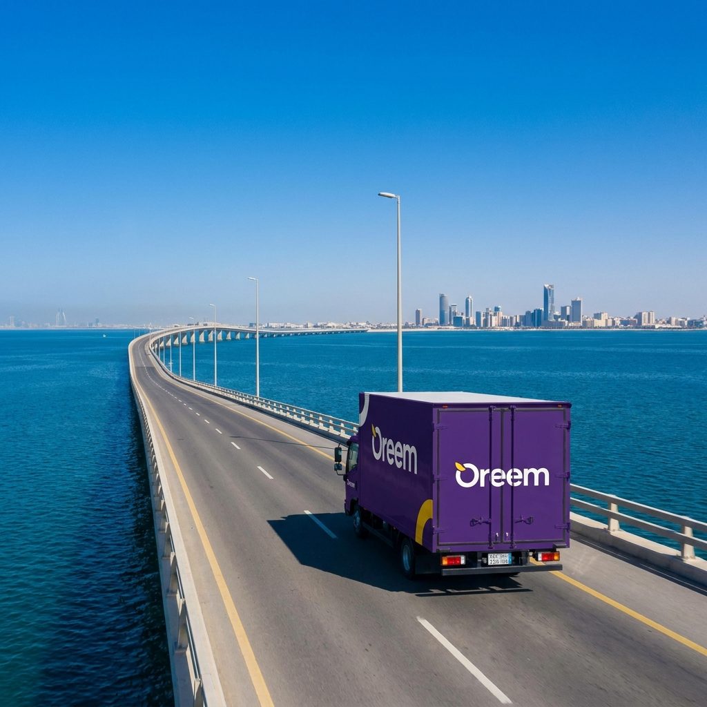 Oreem courier in purple uniform loading a delivery van in Bahrain for fast shipping to the Eastern Province
